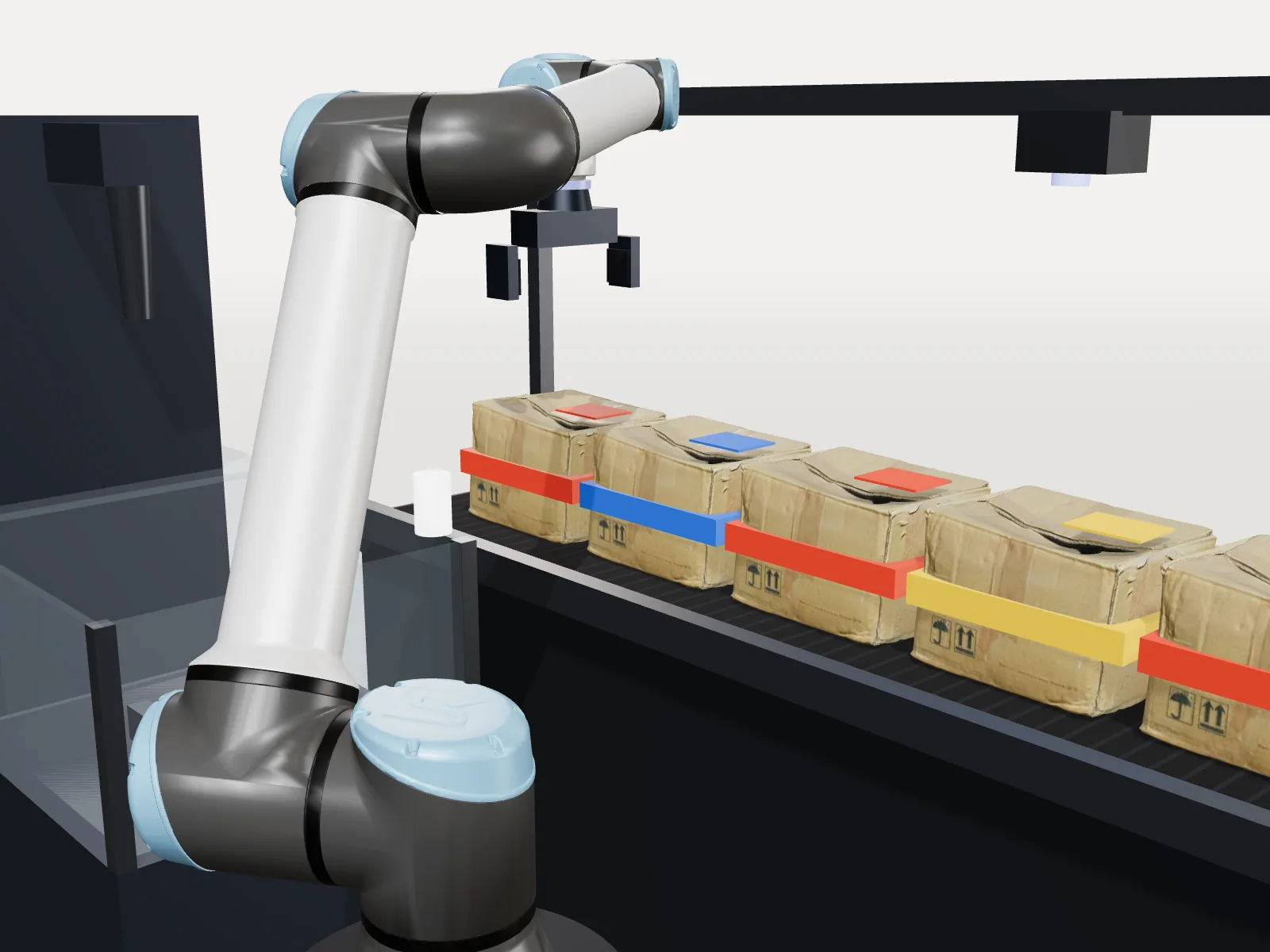 The digital twin: the arm above the red box on the conveyor
